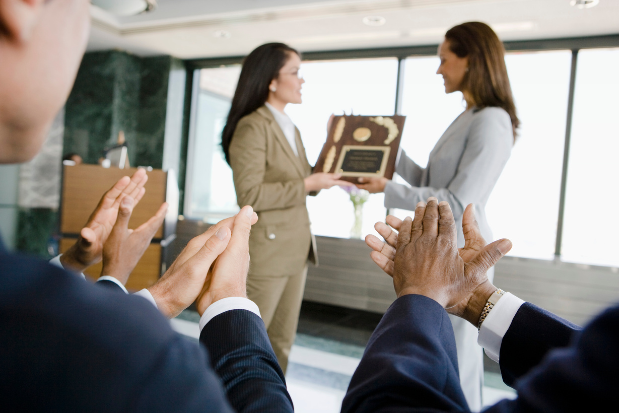 Businesswomen with award